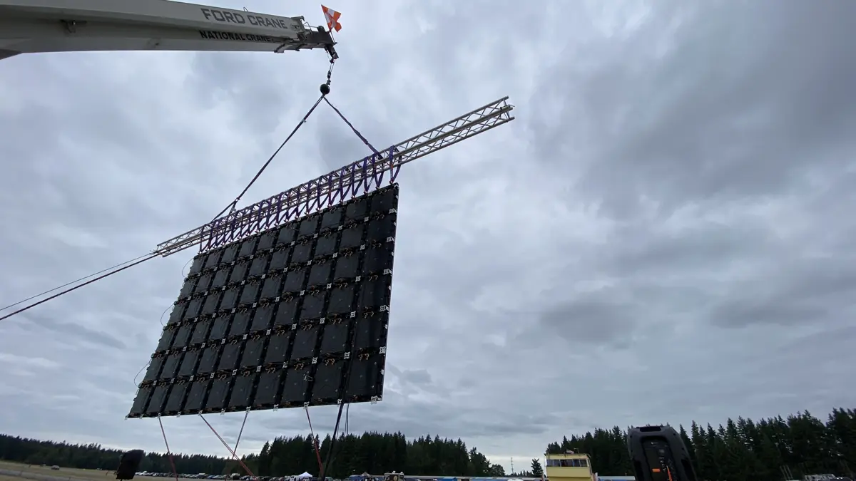 A City Park Events video wall being lifted into place by a crane